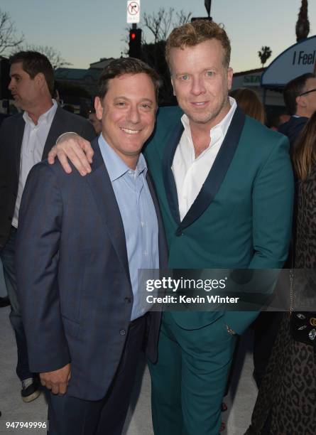 Chairman of STXfilms Adam Fogelson and producer McG attend the premiere of STX Films' "I Feel Pretty" at Westwood Village Theatre on April 17, 2018...