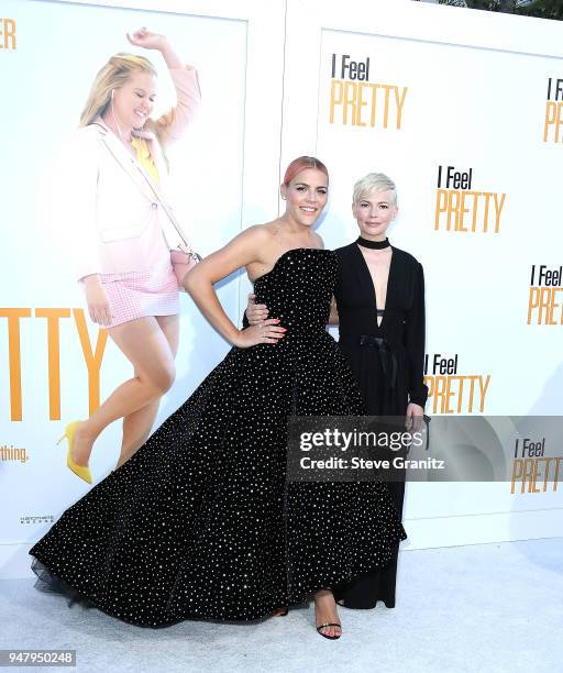 Busy Philipps, Michelle Williams arrives at the Premiere Of STX Films' "I Feel Pretty" at Westwood Village Theatre on April 17, 2018 in Westwood,...