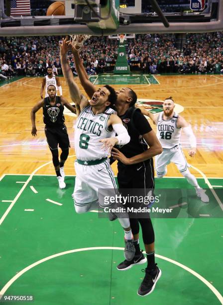 Shane Larkin of the Boston Celtics takes a shot against John Henson of the Milwaukee Bucks during Game Two in Round One of the 2018 NBA Playoffs at...