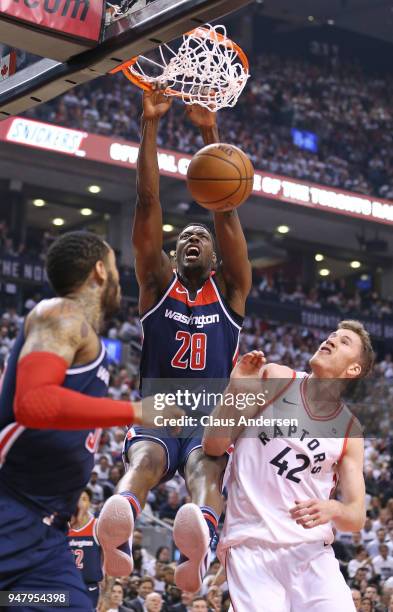 Ian Mahinmi of the Washington Wizards slams a basket against the Toronto Raptors in Game Two of the Eastern Conference First Round in the 2018 NBA...