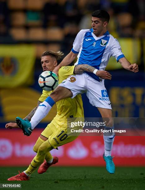 Samuel Castillejo of Villarreal competes for the ball with Arribas of Leganes during the La Liga match between Villarreal and Leganes at Estadio de...