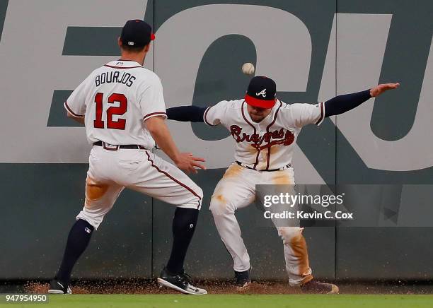 Ender Inciarte of the Atlanta Braves fails to catch this two-RBI double hit by Maikel Franco of the Philadelphia Phillies in the 10th inning at...