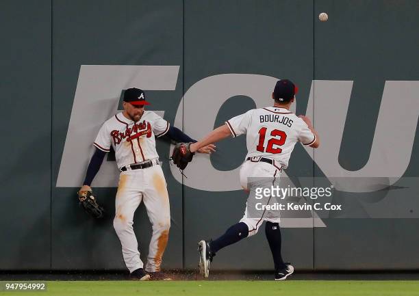 Ender Inciarte of the Atlanta Braves fails to catch this two-RBI double hit by Maikel Franco of the Philadelphia Phillies in the 10th inning at...
