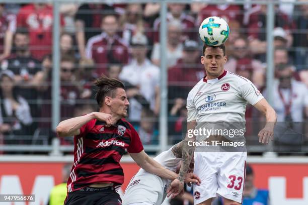 Stefan Kutschke of Ingolstadt and Georg Margreitter of Nuernberg battle for the ball during the Second Bundesliga match between FC Ingolstadt 04 and...