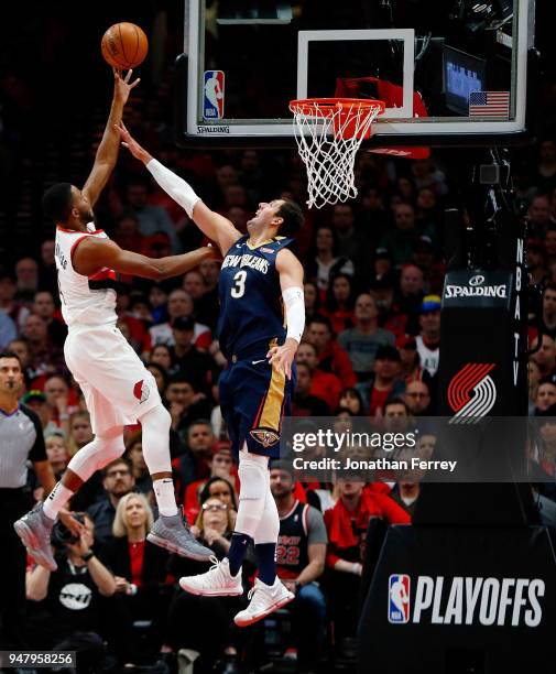 Nikola Mirotic of the New Orleans Pelicans defends the shot of Maurice Harkless of the Portland Trail Blazers during Game One of the Western...