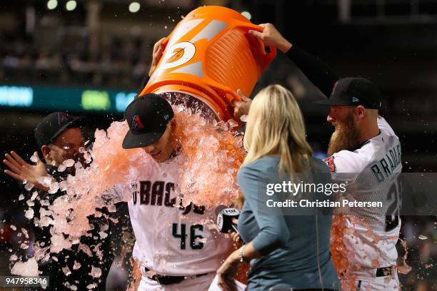 Starting pitcher Patrick Corbin of the Arizona Diamondbacks is dunked with gatorade by Andrew Chafin and Archie Bradley after pitching a compete game...
