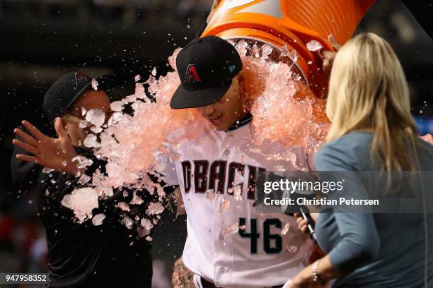 Starting pitcher Patrick Corbin of the Arizona Diamondbacks is dunked with gatorade by Andrew Chafin and Archie Bradley after pitching a compete game...