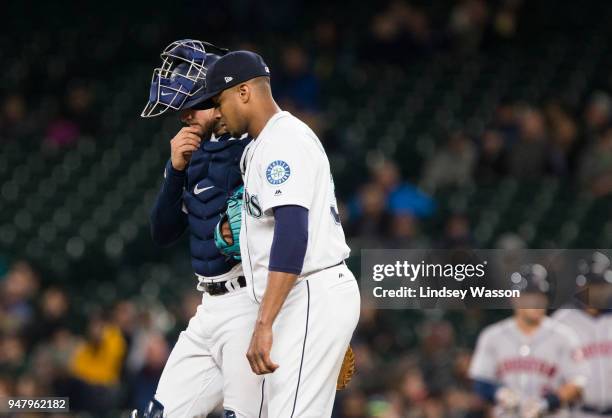 Mike Marjama of the Seattle Mariners and Ariel Miranda of the Seattle Mariners talk on the mound as the bases are loaded in the fifth inning at...