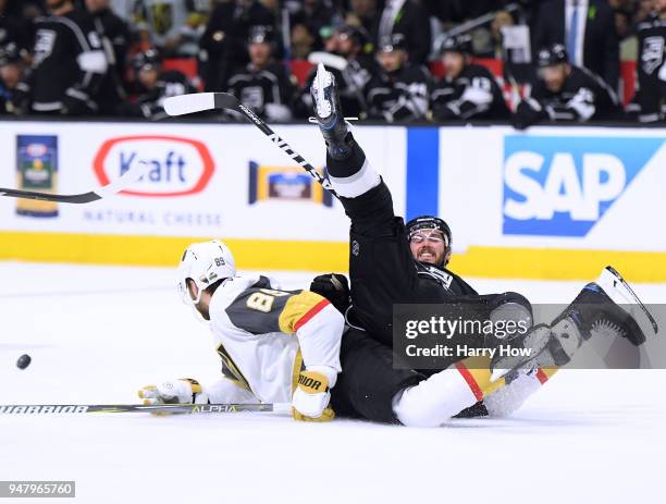 Torrey Mitchell of the Los Angeles Kings falls over Alex Tuch of the Vegas Golden Knights during the second period in Game Four of the Western...
