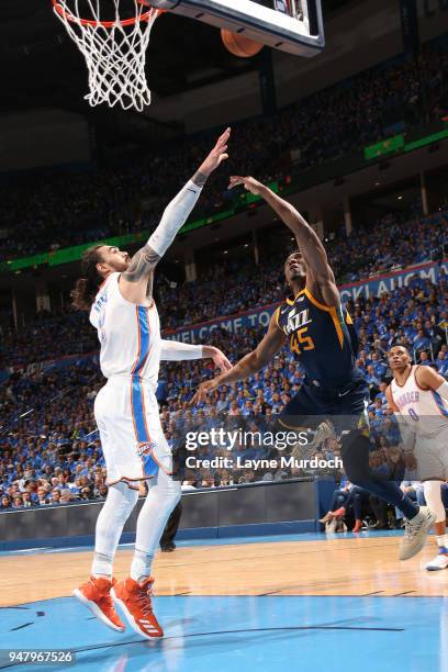 Steven Adams of the Oklahoma City Thunder and Donovan Mitchell of the Utah Jazz wait for the ball during Game One of Round One of the 2018 NBA...