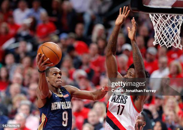 Rajon Rondo of the New Orleans Pelicans drives against Ed Davis of the Portland Trail Blazers during Game One of the Western Conference Quarterfinals...