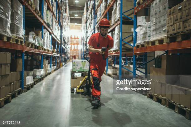 warehouse worker - picking up groceries stock pictures, royalty-free photos & images