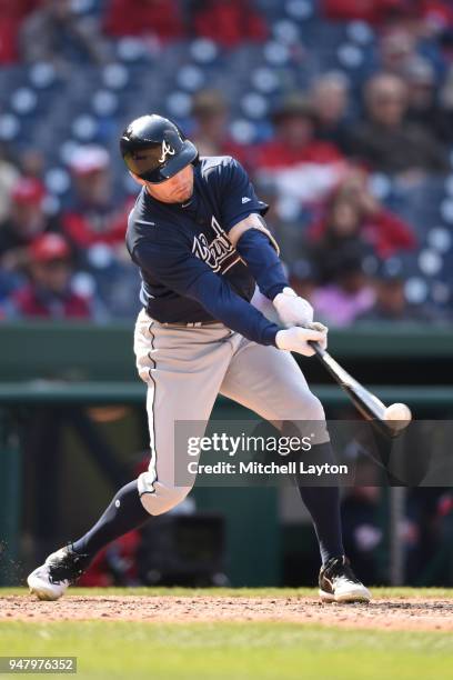 Peter Bourjos of the Atlanta Braves takes a swing during a baseball game against the Washington Nationals at Nationals Park on April 11, 2018 in...