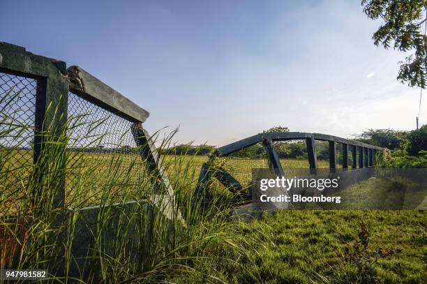 Damaged elephant fencing stands near Hambantota Port, operated by China Merchants Group, in Hambantota, Sri Lanka, on Wednesday, March 28, 2018....