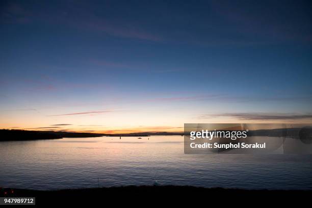 sunset on the sea in front of the akershus harbour, oslo - sunphol stock pictures, royalty-free photos & images