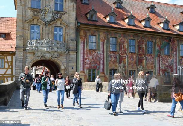 People walking close to the dome on a sunny and hot spring day in Bamberg, Northern Bavaria, Germany. The in Germany will be close to 30 degrees...