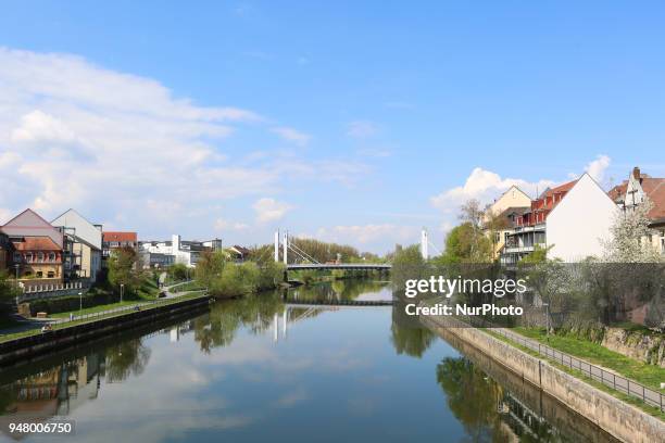 Bridge and some houses are seen on a sunny and hot spring day in Bamberg, Northern Bavaria, Germany. The in Germany will be close to 30 degrees...
