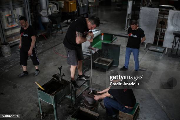 Turkish glassblower Mustafa Dalkilic forms a piece at Glass House Association's workshop in Riva district of Istanbul, Turkey on April 11, 2018....