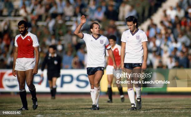January 1986 Cairo, friendly international football match, Egypt v England, Ray Wilkins speaks to Mark Hateley as they walk from the pitch at half...