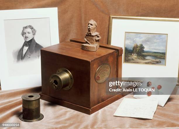 Daguerreotype camera made by Alphonse Giroux in Paris in 1839 and a portrait of Louis Jacques Mandé DAGUERRE are exhibited by the French Company of...