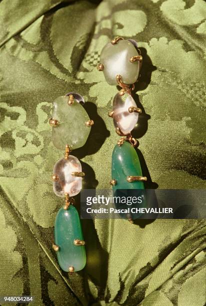 The Yves Saint Laurent fashion house, decoration by Jacques GRANGE. On the couch's damask padding, Baroque earrings in rock crystal and hard rock,...
