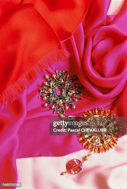 The Yves Saint Laurent Fashion House, decoration by Jacques GRANGE. Silk scarves in vibrant pinks and oranges, so dear to Yves Saint Laurent and a...