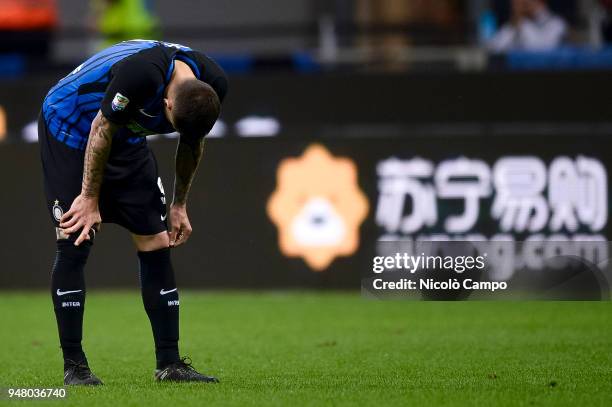 Mauro Icardi of FC Internazionale looks dejected while Suning announcement is shown on an advertising billboard during the Serie A football match...