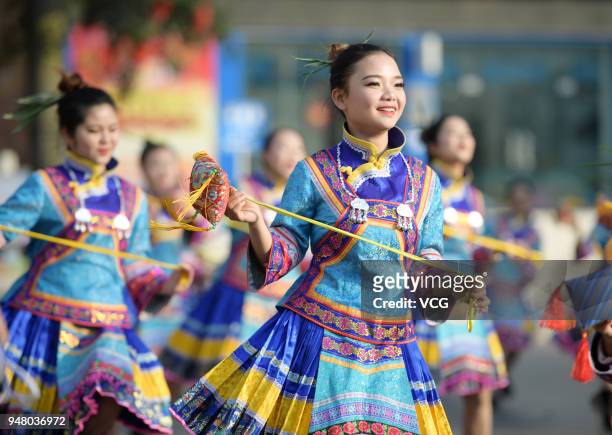 Chinese women of Bouyei ethnic group dance to celebrate Sanyuesan Festival at Wangmo County on April 18, 2018 in Qianxinan Bouyei and Miao Autonomous...