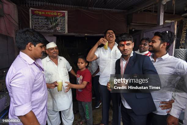 Indian Wrestler Rahul Aware who won gold medal in Commonwealth Games in Australia drinks sugarcane juice after he visits Gokul Vastad Talim, on April...