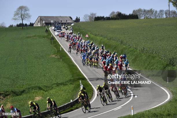The pack rides during the 82nd edition of the men's race of 'La Fleche Wallonne', a one day cycling race 5km from Seraing to Huy, on April 18, 2018....