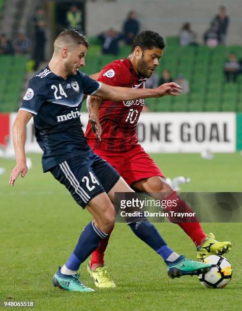 Terry Antonis of Melbourne Victory and Hulk of Shanghai compete for the ball during the AFC Champions League match between Melbourne Victory and...