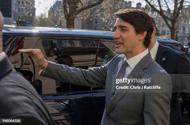 Canadian Prime Minister Justin Trudeau leaves Canada house whilst Greenpeace activists build a wood and card 'oil pipeline' outside the Canadian High...