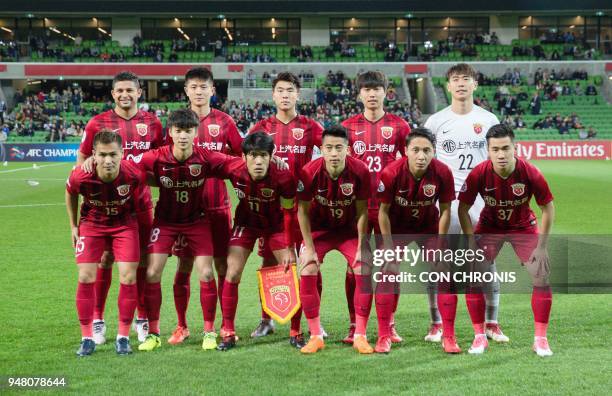 Shanghai SIPG players pose for a team photo during the AFC Champions League Group F football match between Australia's Melbourne Victory and China's...