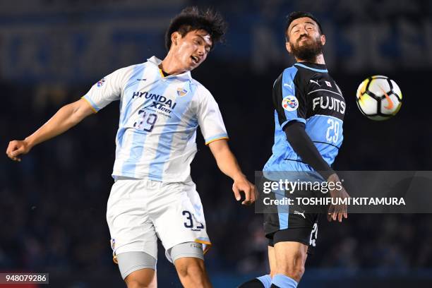 Ulsan Hyundai forward Oh Se-Hun fights for the ball with Kawasaki Frontale defender Michael Fitzgerald during the AFC champions league Group F...