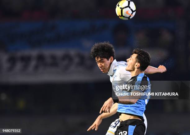 Ulsan Hyundai forward Oh Se-Hun fights for the ball with Kawasaki Frontale defender Eduardo during the AFC champions league Group F football match...