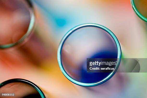 group of colored test tubes from above - test tube stock pictures, royalty-free photos & images