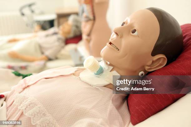 An instructional anatomical training dummy lies in a hospital bed at a training center for senior citizen care providers at the Evangelical Johannes...