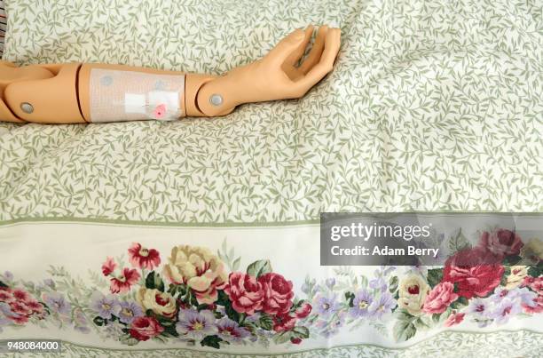 An instructional anatomical training dummy lies in a hospital bed at a training center for senior citizen care providers at the Evangelical Johannes...