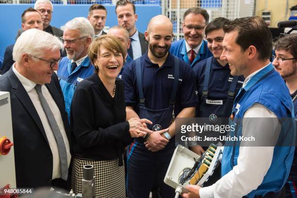 German President Frank-Walter Steinmeier and his wife Elke Buedenbender talk to trainees and training teachers at BMW Group Plant Leipzig on April...