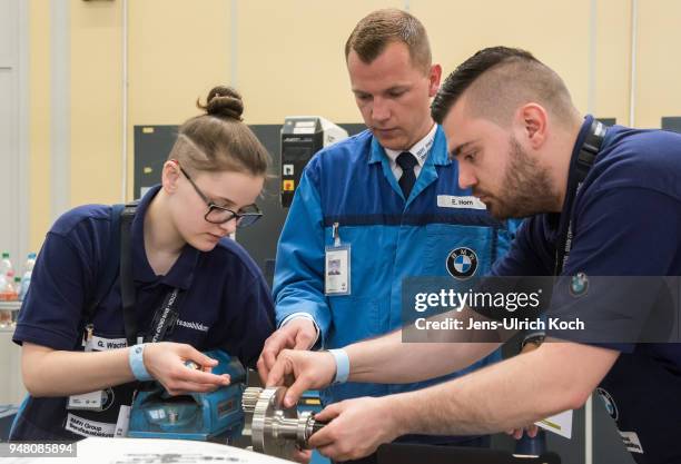 Training teacher watches trainees at a metal works training center at BMW Group Plant Leipzig on April 18, 2018 in Leipzig, Germany. Germany....