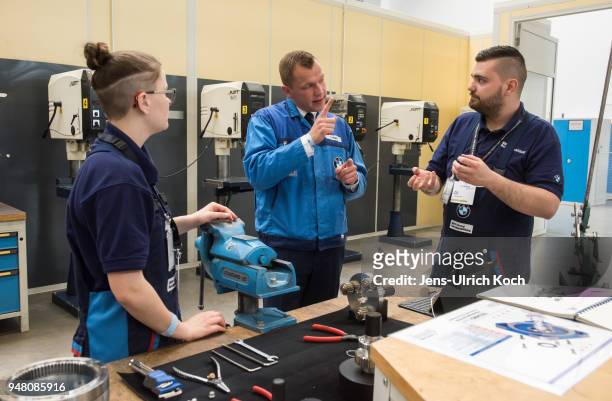 Training teacher talks to trainees at a metal works training center at BMW Group Plant Leipzig on April 18, 2018 in Leipzig, Germany. Germany....