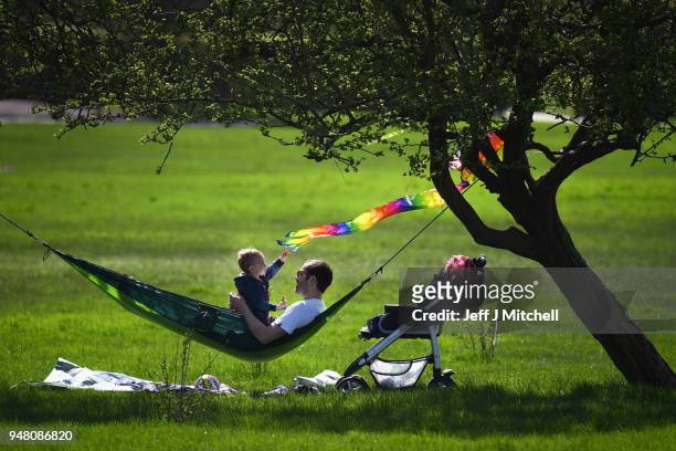 Members of the public enjoy the sunshine on Primrose Hill as spring temperatures arrive on April 18, 2018 in London, England. London is expected to...
