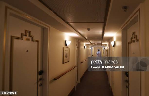 General view shows a corridor of rooms on The Queen Elizabeth II luxury cruise liner, also known as the QE2, docked at Port Rashid in Dubai, where it...
