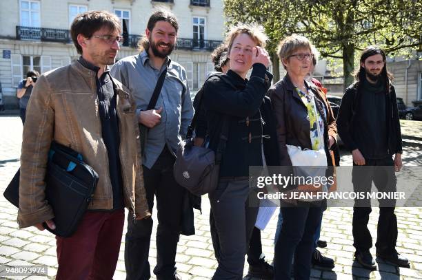 Members of a delegation of occupants of the ZAD of Notre-Dame-des-Landes, who refuse to give their names to the press, arrive for a meeting with the...