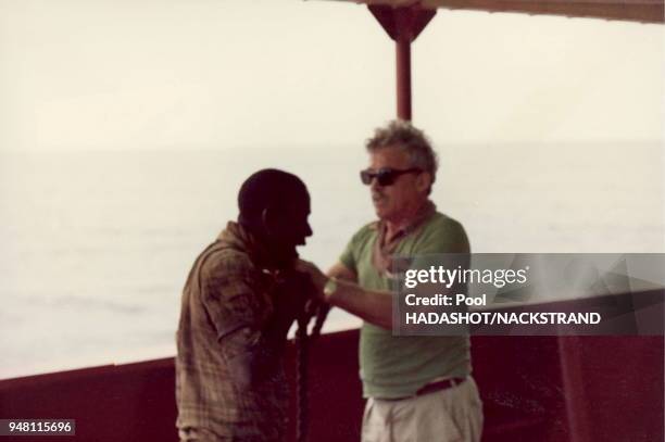 Captain Avner Gilad forces a Kenyan stowaway off his ship, the Moran, off the East African coast shortly after leaving Dar-es-Salaam, Tanzania in...