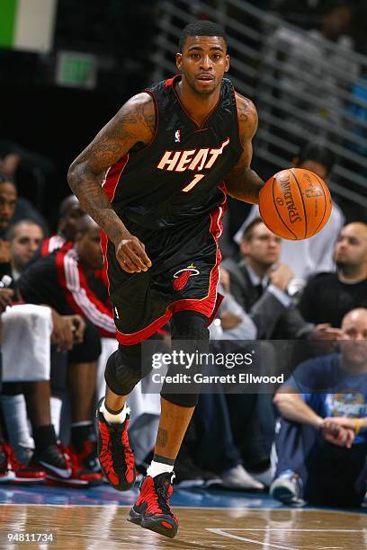 Dorell Wright of the Miami Heat drives the ball up court during the game against the Denver Nuggets on December 3, 2009 at the Pepsi Center in...