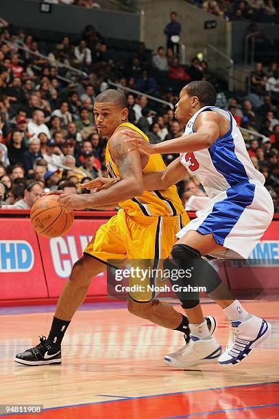 Earl Watson of the Indiana Pacers moves the ball against Sebastian Telfair of the Los Angeles Clippers during the game at Staples Center on December...