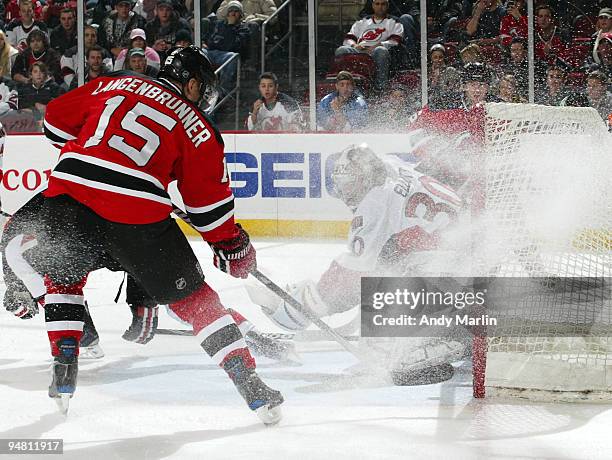 Jamie Langenbrunner of the New Jersey Devils puts the puck past Brian Elliott of the Ottawa Senators for a first period goal during their game at the...