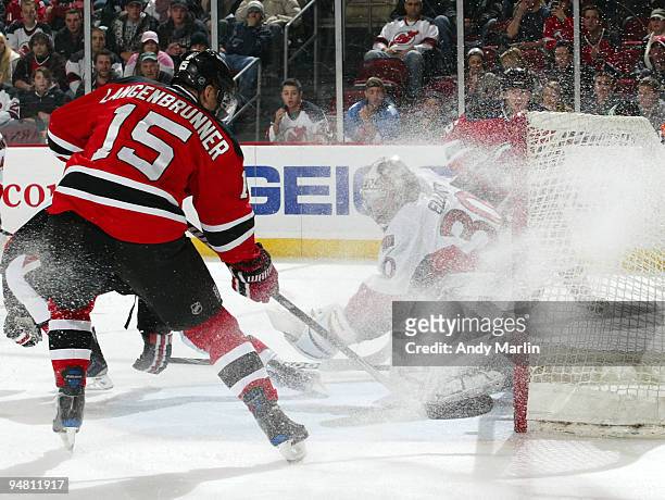 Jamie Langenbrunner of the New Jersey Devils puts the puck past Brian Elliott of the Ottawa Senators for a first period goal during their game at the...