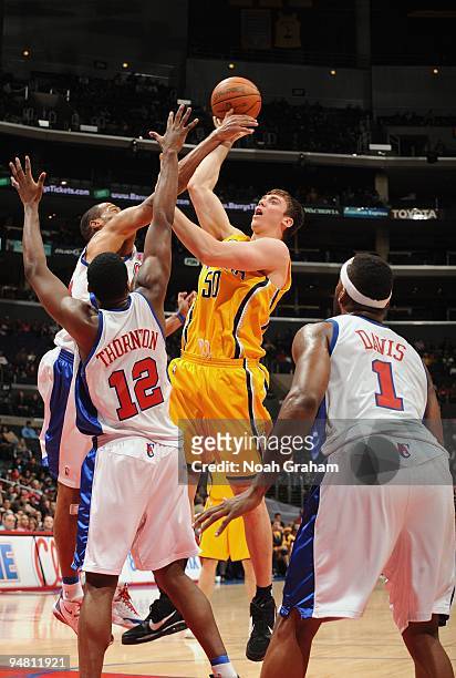 Tyler Hansbrough of the Indiana Pacers shoots against Marcus Camby and Al Thornton of the Los Angeles Clippers during the game at Staples Center on...